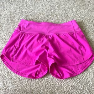Lululemon Speed Up shorts 4 in. Color is Sonic Pink.